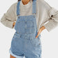 Light-wash square neck denim overalls with rolled cuffs and pockets