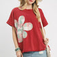 Red short-sleeved Umgee Mineral Wash French Terry Top with green, pink, white patchwork flower design