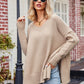 Beige oversized V-neck knit sweater with ribbed cuffs and hem