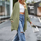 Olive green long sleeve waffle-knit cardigan with relaxed fit and pockets