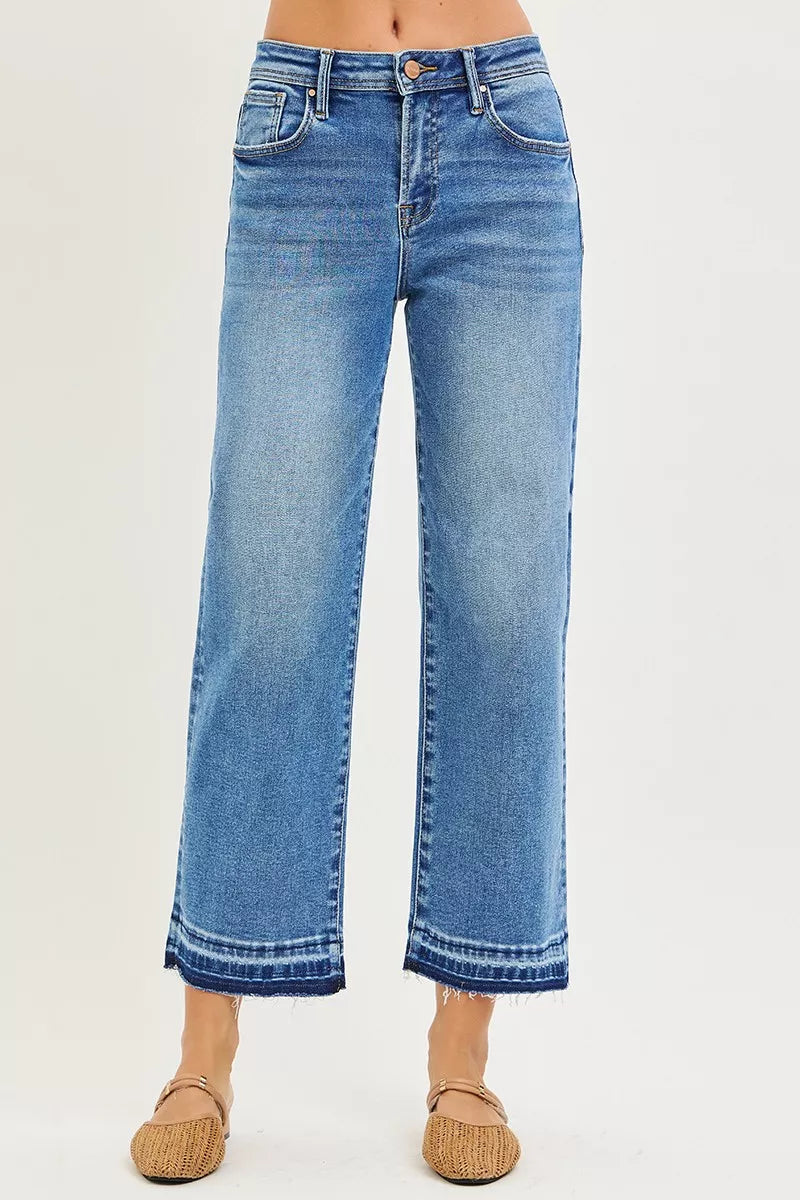 RISEN slouchy cropped boyfriend jeans in blue denim with wide-leg cut and frayed hems