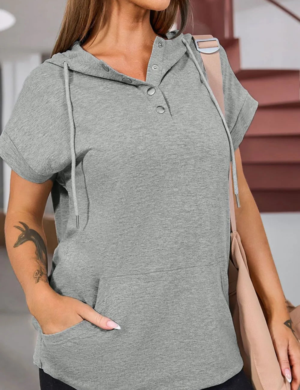 Grey drawstring quarter snap cap sleeve hoodie with mesh sleeve panel