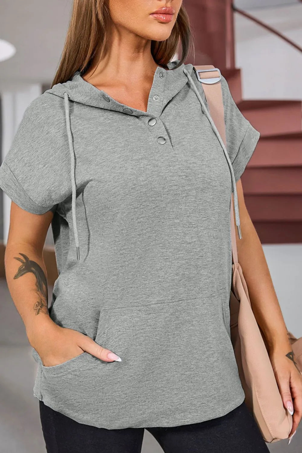 Grey drawstring quarter snap cap sleeve hoodie with mesh sleeve panel