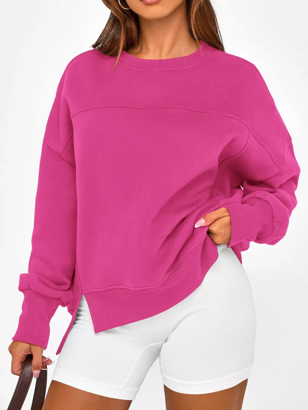A woman wearing a long sleeve sweatshirt 
