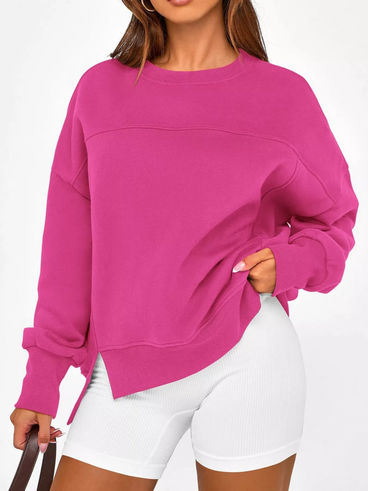 A woman wearing a long sleeve sweatshirt 