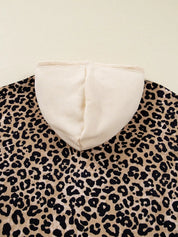 Leopard print long sleeve hoodie with cream hood lining, drawstring and pocket