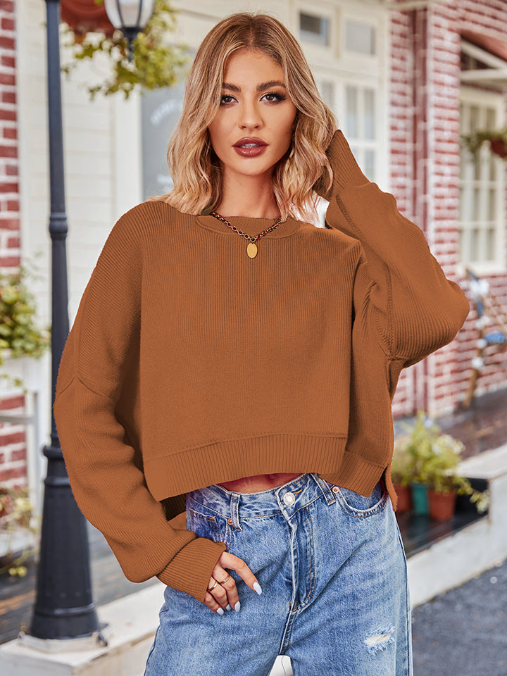 Brown ribbed knit cropped sweater with dropped shoulders and long sleeves