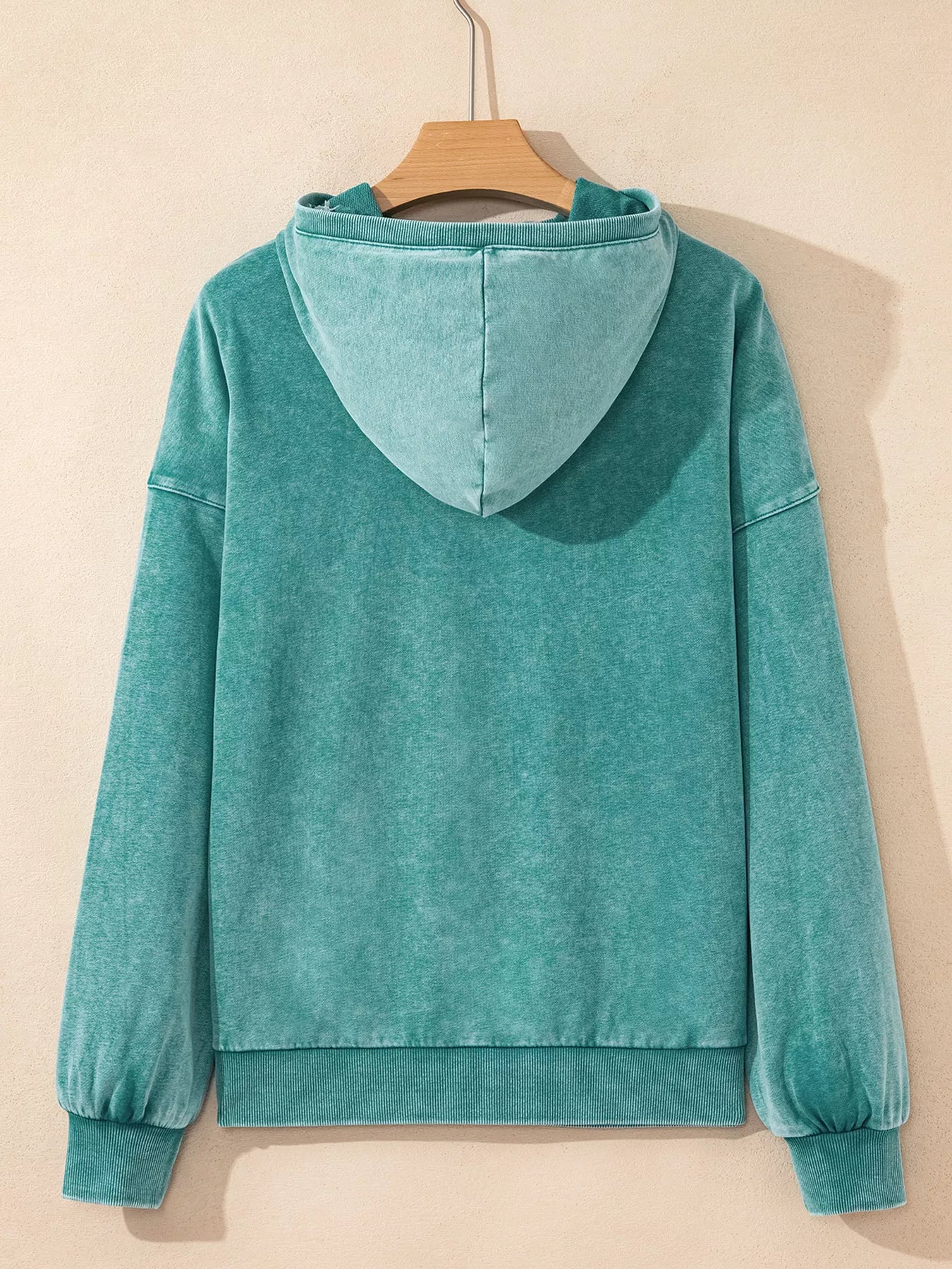 Teal velvet women’s half zip kangaroo pocket baggy hoodie on hanger