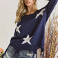 Navy blue ADORA distressed star sweater top with white patterns and fringed hem