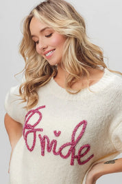 Cream-colored sequined bride sweater with heart accents