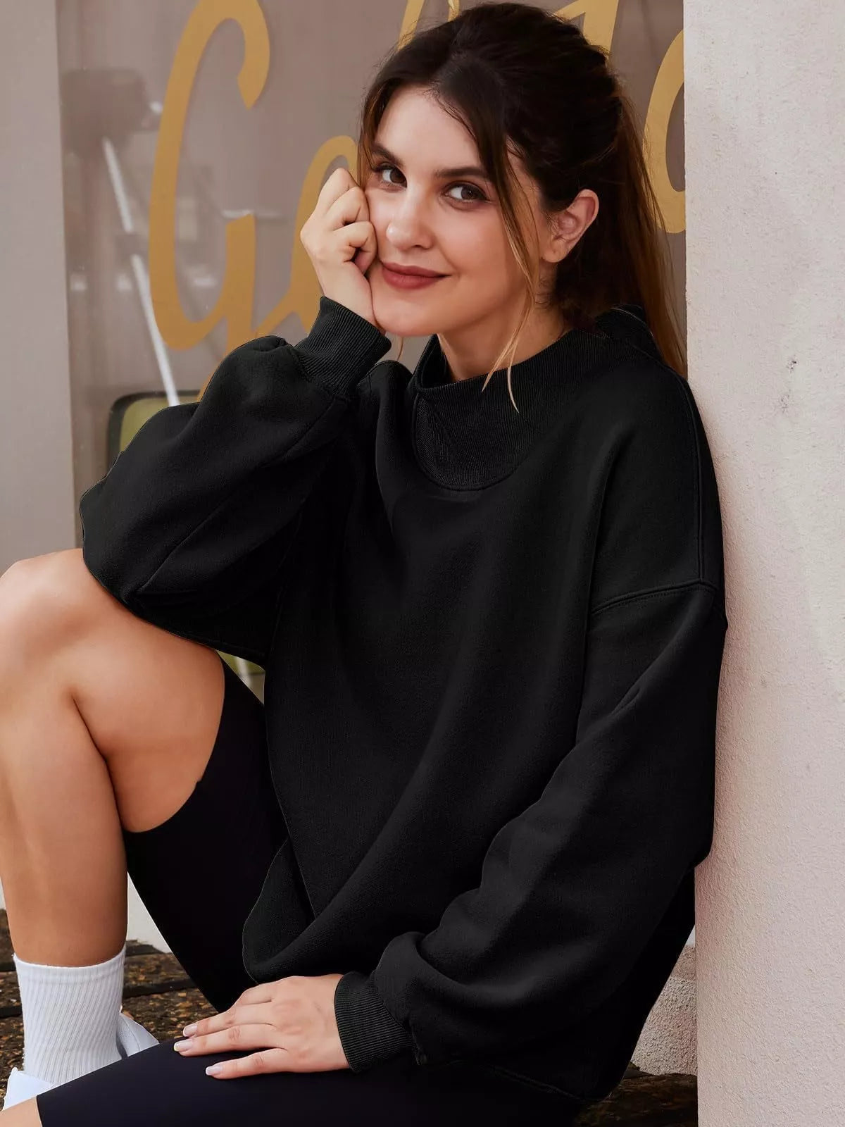 Black mock neck dropped shoulder sweatshirt with ribbed cuffs