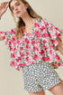 Pink floral boxy fit ruffled short sleeve blouse with v-neckline