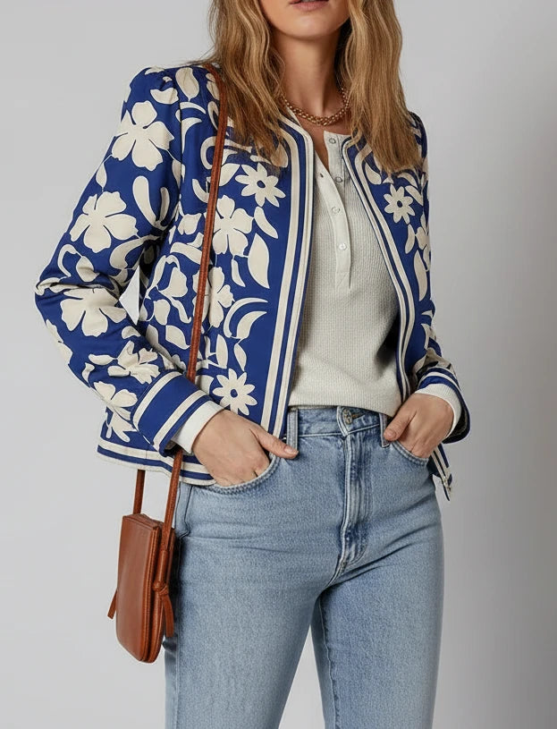Blue and white floral bomber jacket with striped trim and buttoned cuffs