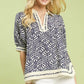 Umgee Geometric Leaf Print Popover Top in navy and cream with puffed sleeves
