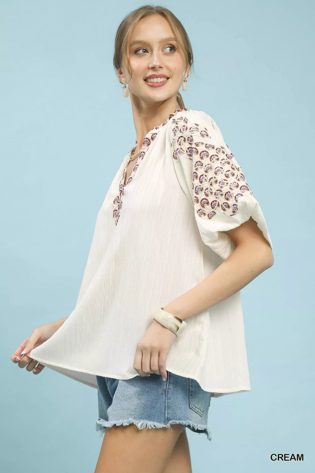 Umgee embroidered sleeve contrast trim top in cream with delicate patterns