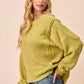 Cozy olive green BiBi boucle rib knit sweater with oversized sleeves
