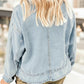 Light-wash oversized denim jacket with frayed hem and button-up design