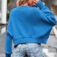 Vibrant blue round neck drop shoulder long sleeve cropped knit sweater with ribbed cuffs and hem