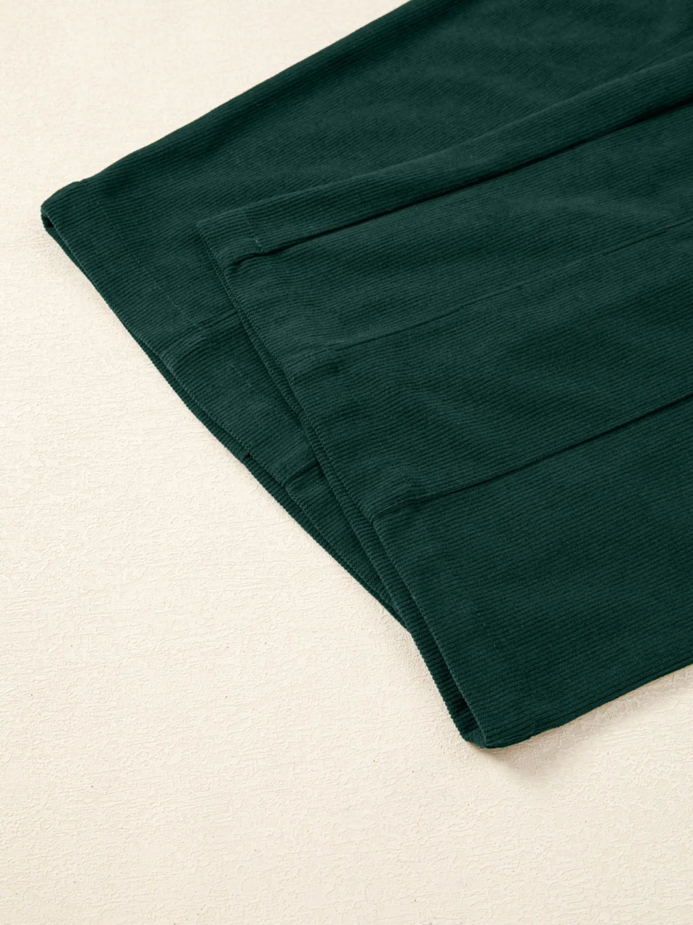 Dark green ribbed corduroy women’s V-neck sleeveless jumpsuit with pockets