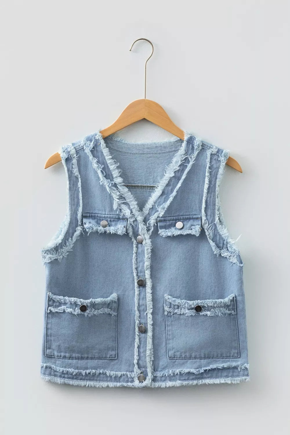Light blue frayed edge flap pockets denim vest jacket with button closures
