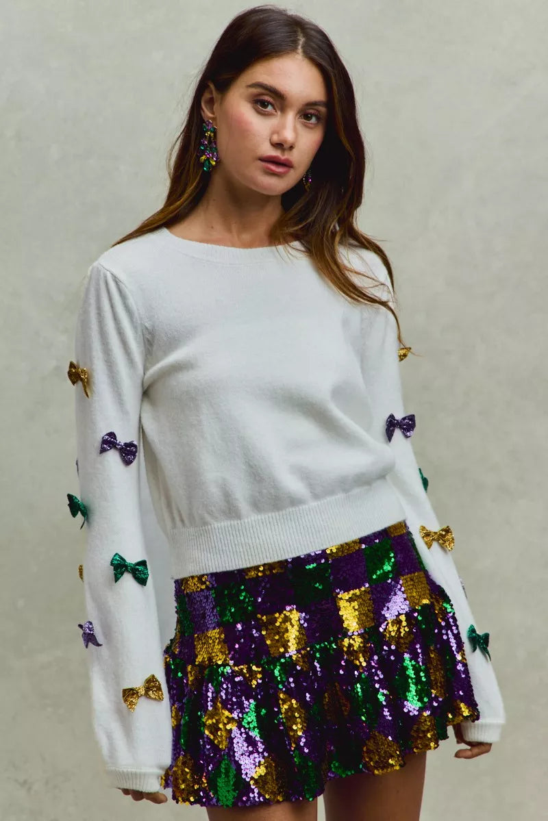 White SO ME Mardi Gras sweater with colorful sequined bows