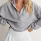 Gray Exposed Seam Dropped Shoulder Hoodie with half-zip front and ribbed cuffs