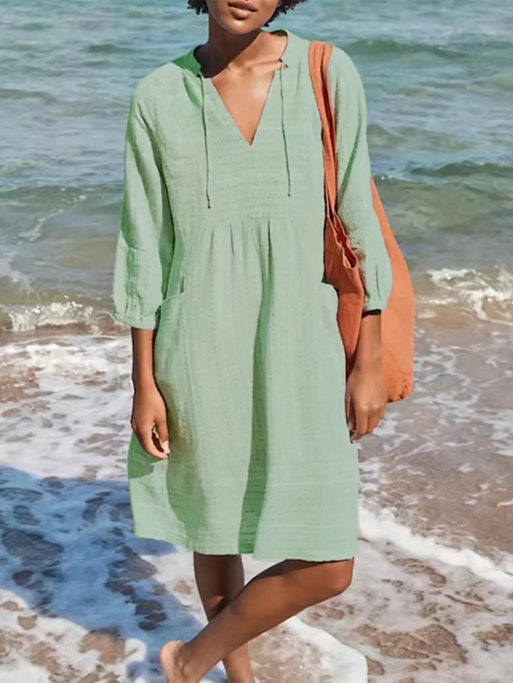 Soft mint green linen V-neck mini dress with drawstring and 3/4 sleeves