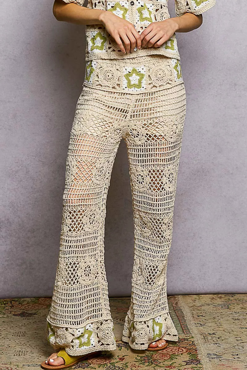 Cream-colored POL openwork crochet flare pants with green star pattern