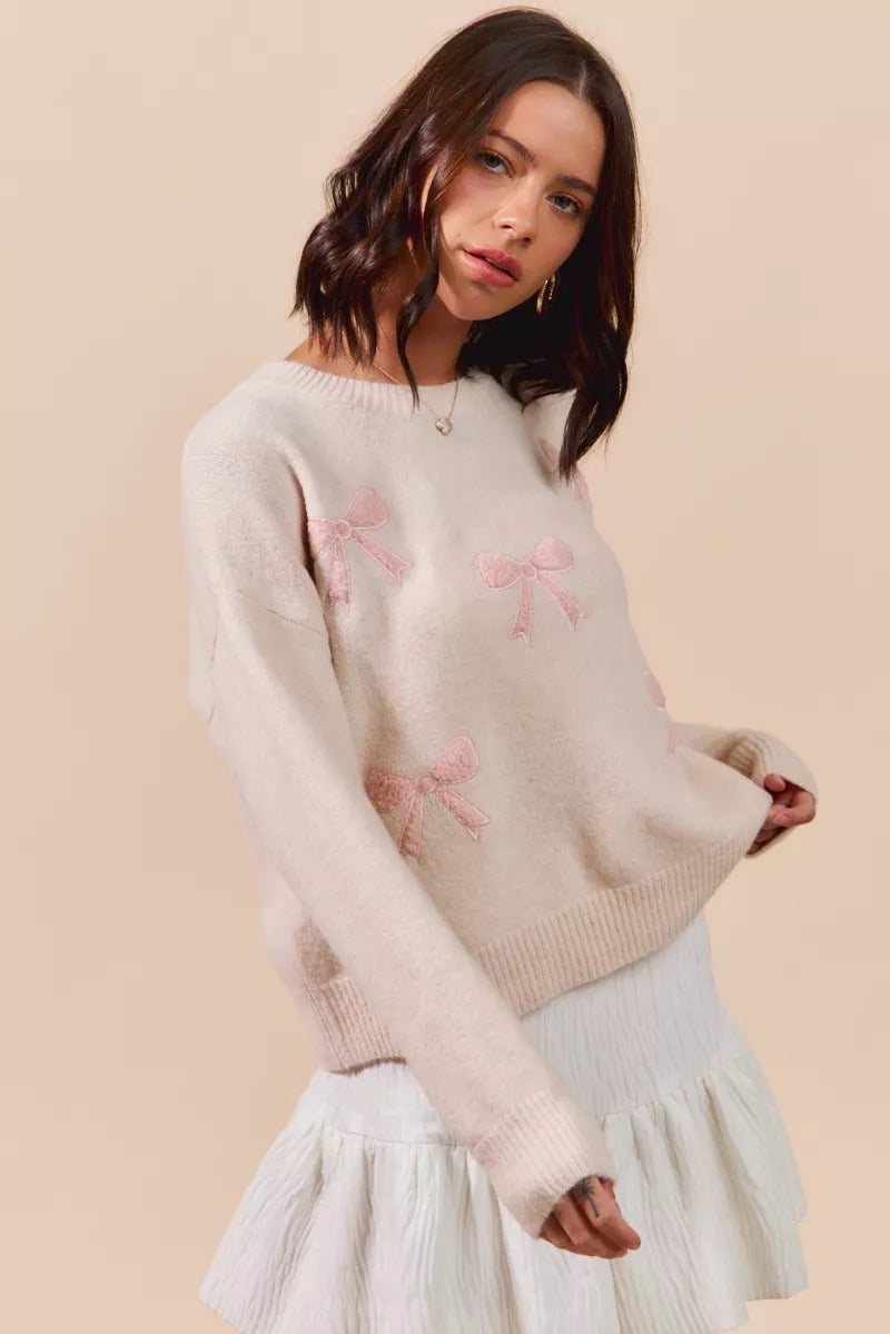 Cream-colored SO ME knit sweater with pink bow embroidery