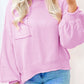 Soft pink drop shoulder sweater with raw edge ribbed details and puffed sleeves