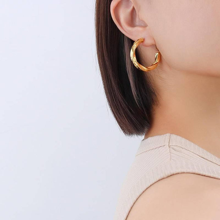 Golden twist hoop earrings Earrings