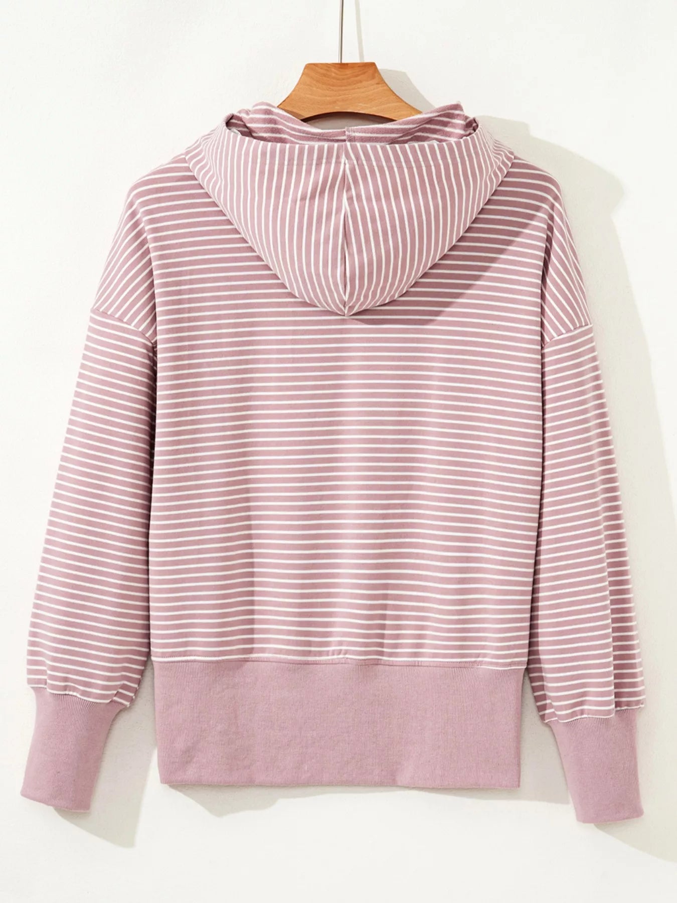 Dusty pink striped thumbhole hoodie with relaxed fit and drop shoulders
