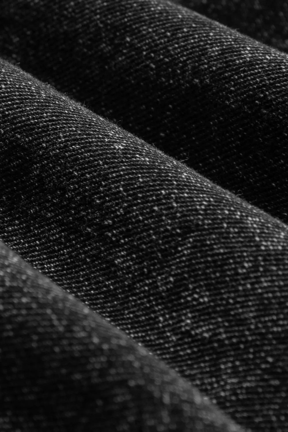 Black denim fabric with speckled texture in Distressed Wide Strap Denim Overalls