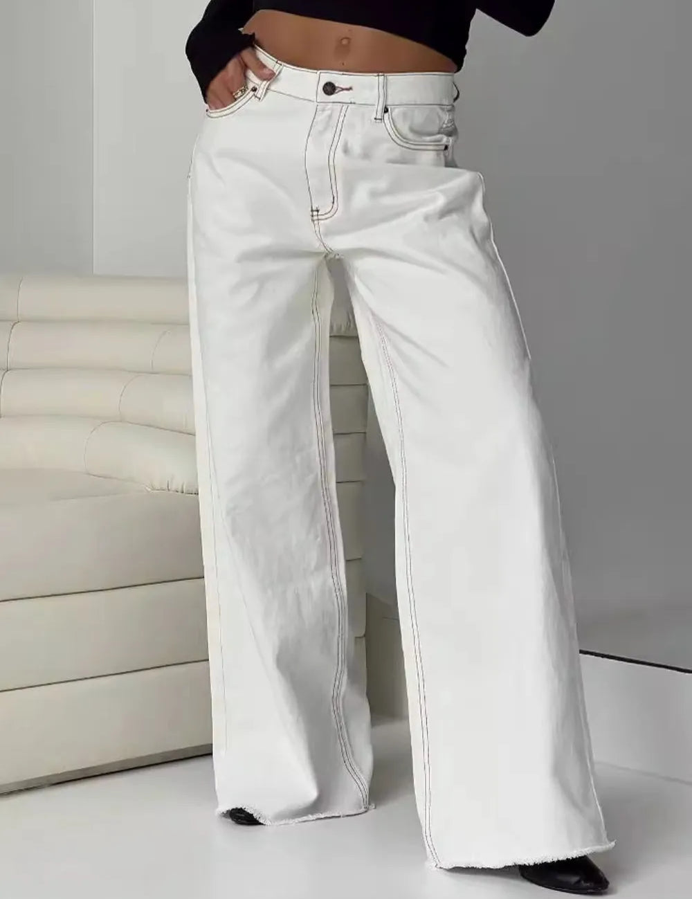 White wide-leg high-waist jeans with button fly and pockets