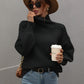 Black ribbed knit turtleneck sweater with balloon sleeves by Daverri