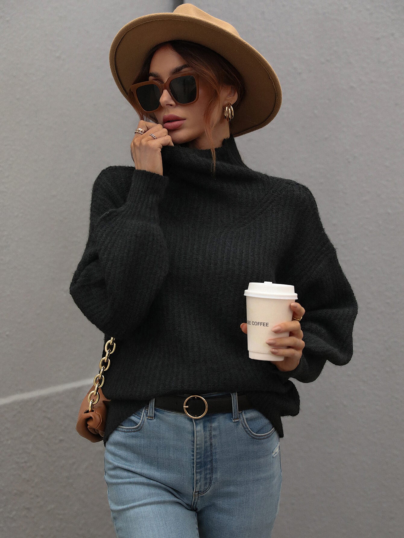 Black ribbed knit turtleneck sweater with balloon sleeves by Daverri