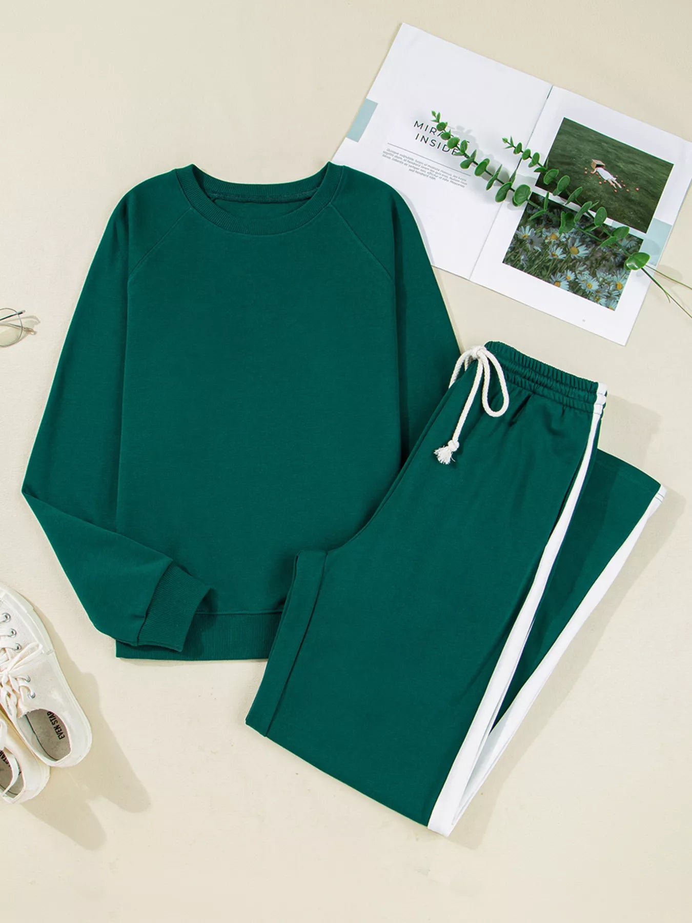 Green tracksuit set with round neck top, white stripes, drawstring pants