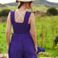 Purple Davi & Dani smocked bodice jumpsuit with crisscross straps