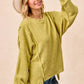 Cozy olive green BiBi Boucle Rib Knit sweater with side ties