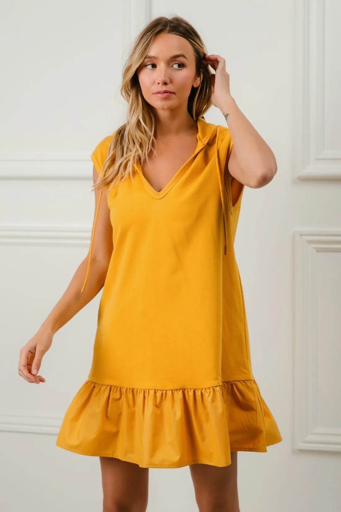Vibrant yellow sleeveless BiBi ruffled French terry hooded dress with V-neckline and hem
