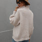 Daverri beige ribbed knit turtleneck sweater with balloon sleeves