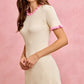 SO ME cream ribbed knit mini dress with pink ruffle trim