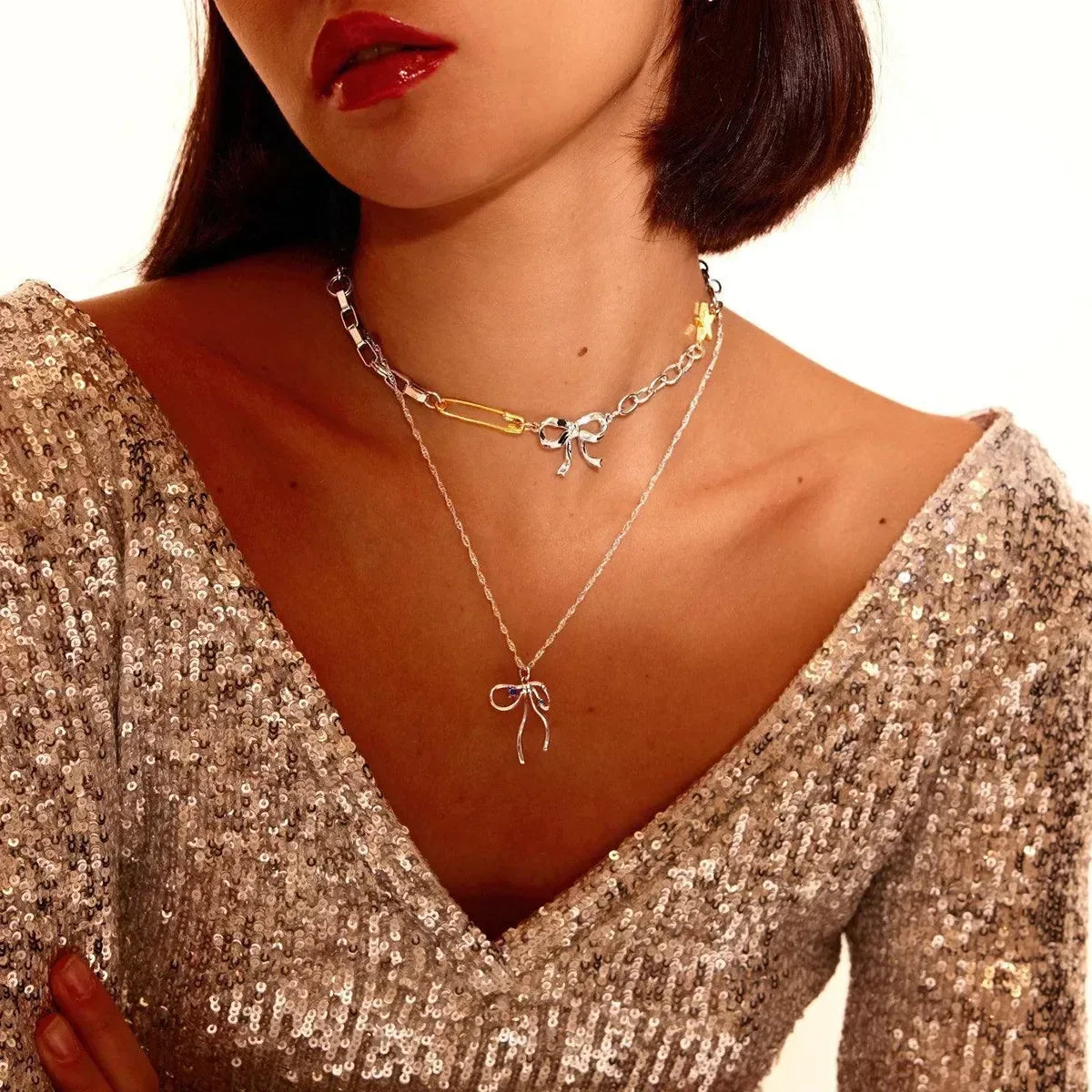 Two-Tone Stainless Steel Bow Star Necklace - DAVERRI FASHIONS