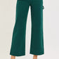 RISEN emerald green high-waisted wide-leg denim cargo pants with rolled cuffs