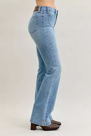 Judy Blue mid-rise bootcut jeans in light blue denim with brown belt