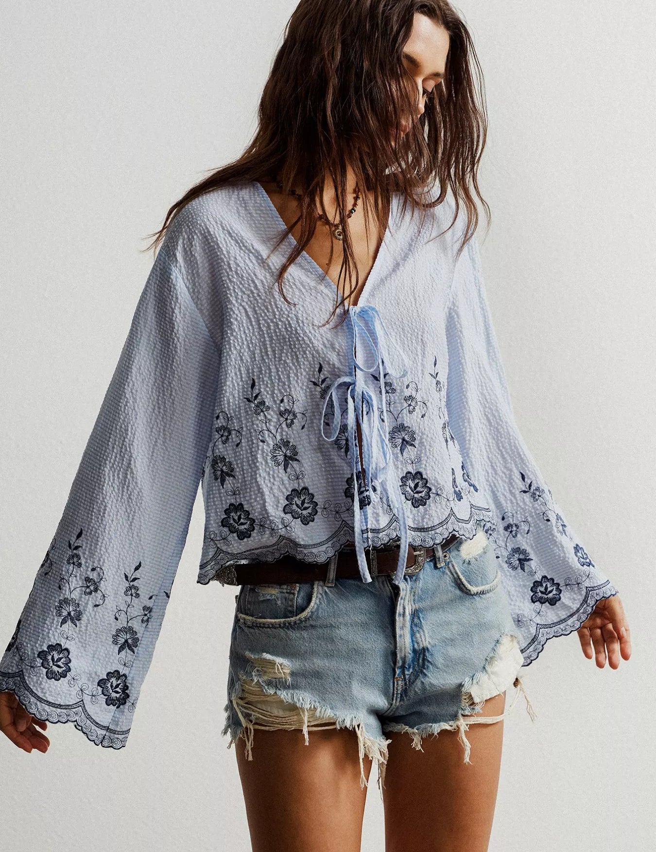 Light blue boho floral embroidered tie-front blouse with bell sleeves