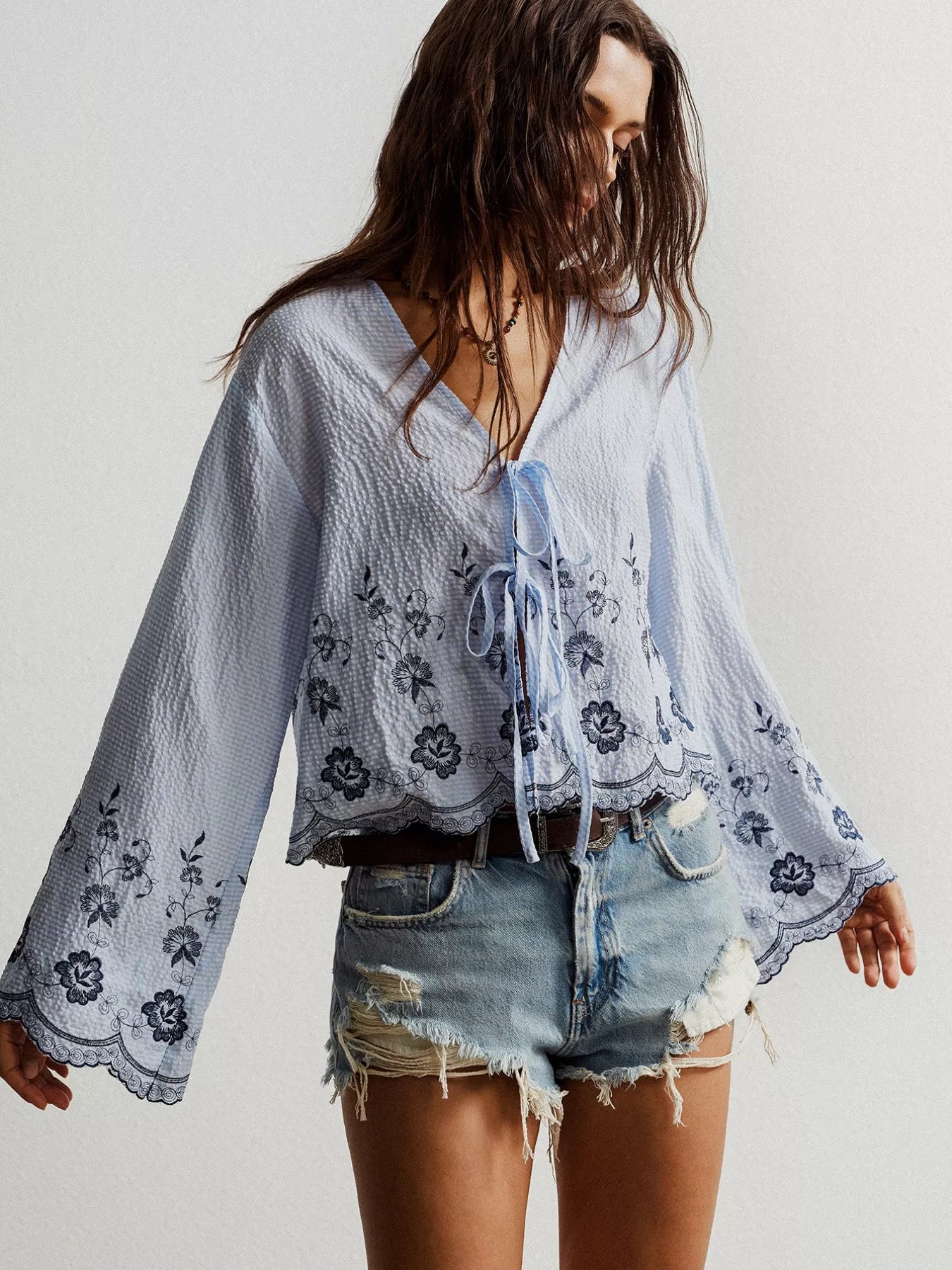 Light blue boho floral embroidered tie-front blouse with bell sleeves