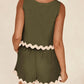 Daverri Fashions olive green sleeveless romper with white scalloped trim