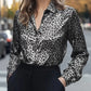 Sleek black and silver leopard-print satin button-up blouse