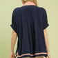 Navy blue Umgee linen V-neck blouse with peach trim collar and hem